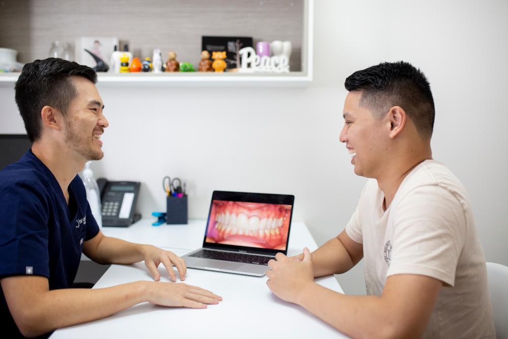 patient learning about cosmetic dentistry in highgate hill QLD