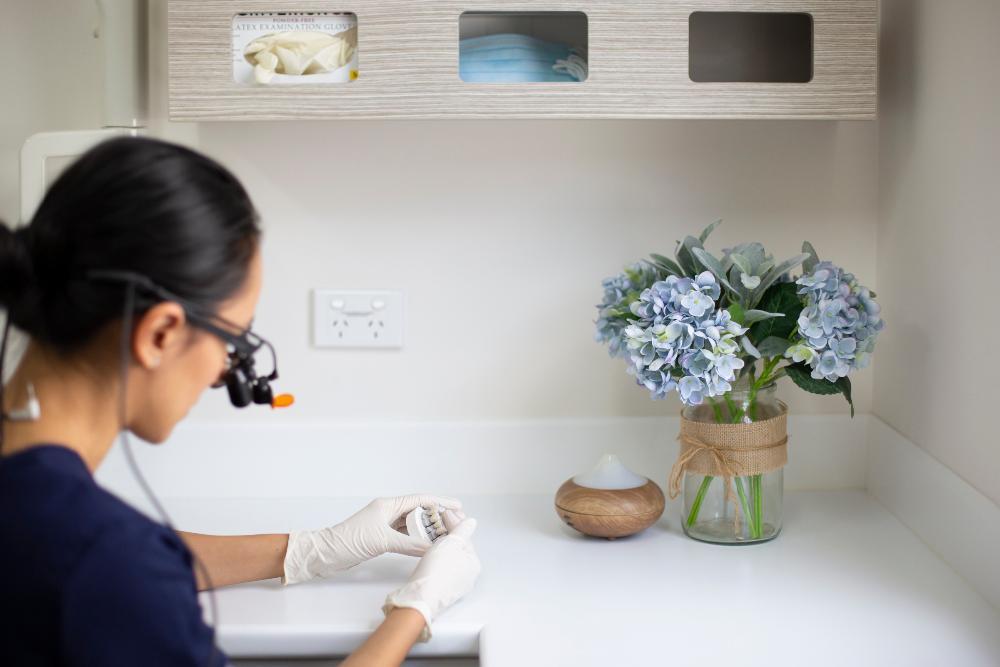 dentist working on a dental crown in highgate hill