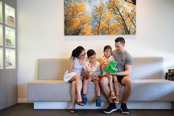 family in dental waiting room in highgate hill QLD