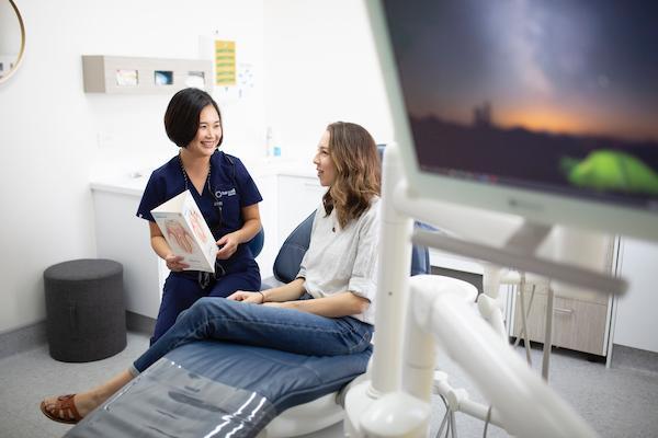 patient learning about periodontal treatments in highgate hill