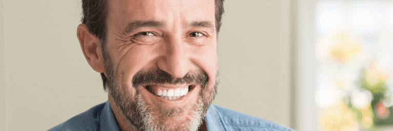 man with dental implants in highgate hill